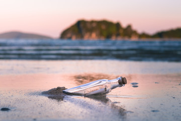 Message in a bottle on the beach.