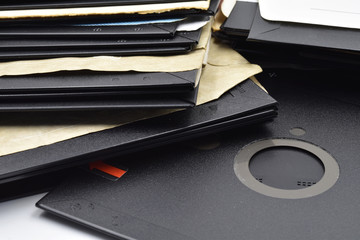 A lot of very old vintage 5¼-inch floppy disk on white background.