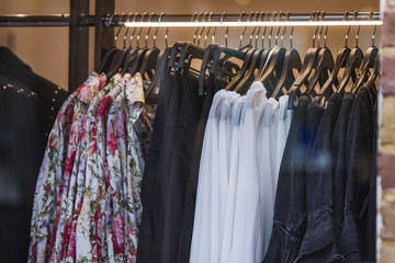 Women clothes on racks in a store in London.