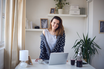 Young business girl in her personal workspace working