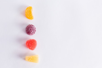 .Bright tasty marmalade on a white background