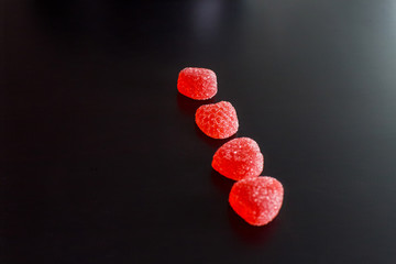 .Bright tasty marmalade on a white background