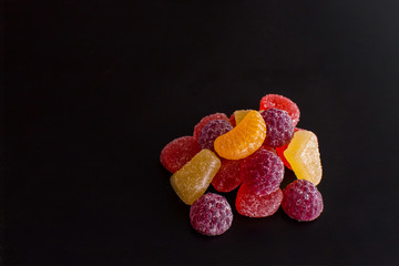 .Bright tasty marmalade on a white background