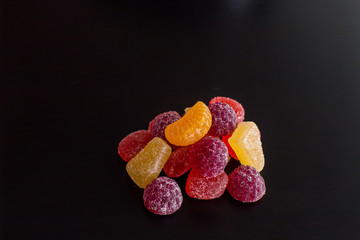 .Bright tasty marmalade on a white background