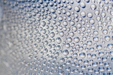 closeup drops water on glass background