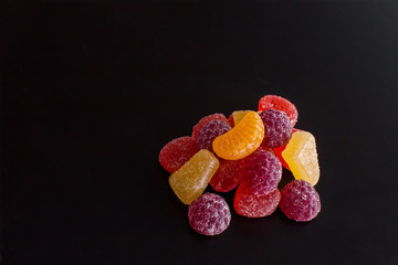 .Bright tasty marmalade on a white background