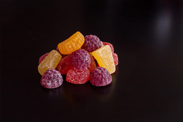 .Bright tasty marmalade on a white background