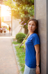 Woman smiling with perfect smile  in a park and looking at camera