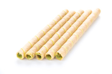rolled wafer with milky green tea cream on white background.