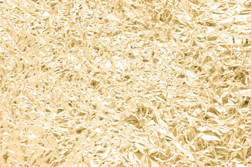 Gold wrinkled paper texture abstract background