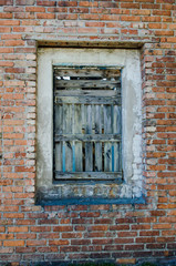 Fototapeta na wymiar brick wall of old brick textured with an old window