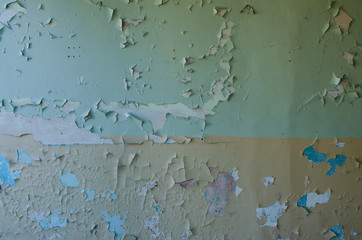 Swollen peeling paint on old wall background texture