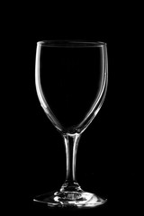 Glass of wine on black background.