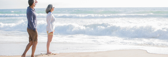 mid aged couple on the beach