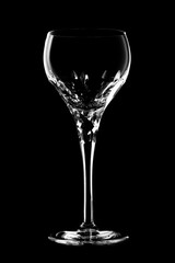 Glass of wine on black background.