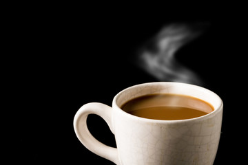 Cup of coffee on black background. Free space for text