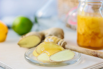 Healthy eating - honey and ginger root slices.