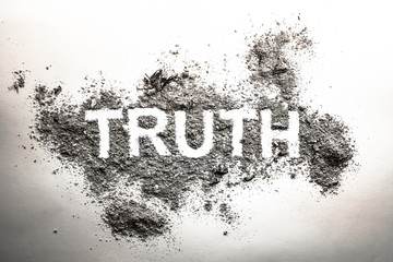 Truth word written in ash, dust, dirt or filth as a cynical concept of lie or post truth in...
