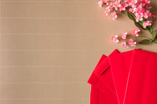 Top View Of Chinese Plum Blossoms And Red Packets On The Table, Chinese New Year Concept, Free Space For Text