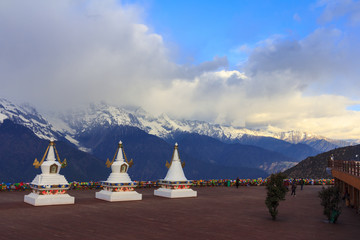 Meili snow mountain and Tibetan stupa, viewpoint from Feilai temple, Deqing, Yunnan, China