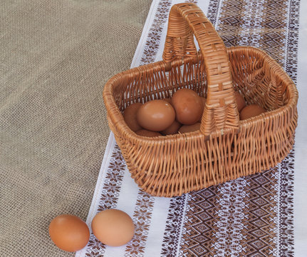 Rustic still life with basket with eggs
