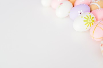 Colorful Easter eggs on white background with space for message