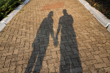 Silhouette of a couple holding hands in India