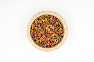 Dog food in a bowl on white background.