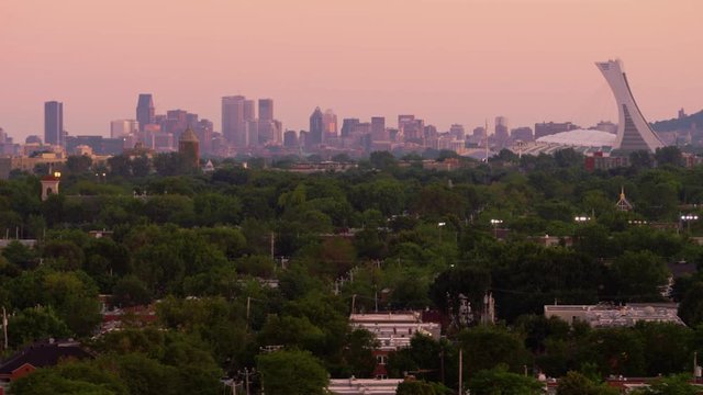 Medium shot of Olympic Stadium and Montreal City Skyline