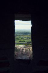 A landscape through the window of the castle