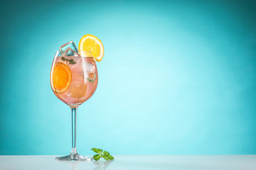 The rose exotic cocktail and fruit on blue