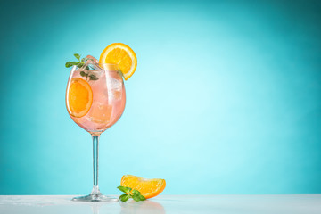 The rose exotic cocktail and fruit on blue