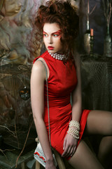 Fototapeta premium young woman with creative visage wearing red dress