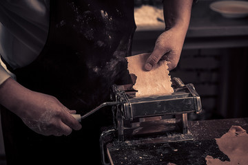 The chef makes fresh spaghetti from scratch.