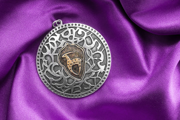 Medallion on satin