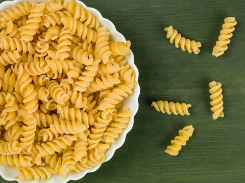 Bowl of Uncooked Fusilli Pasta With Chopped Tomatoes