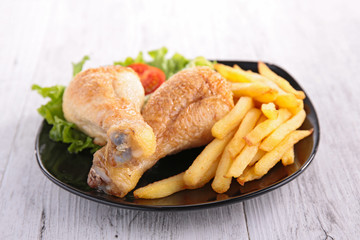 grilled chicken leg and french fries