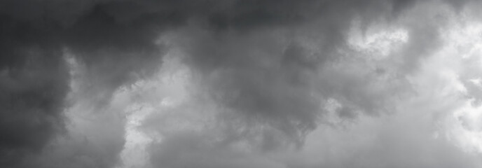 Gray сlouds over horizon, cloudscape, storm. Panorama of a gray gloomy sky.