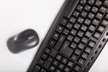 Black keyboard with a mouse on a white background. Isolate