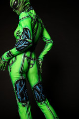 Model in suit of green alien