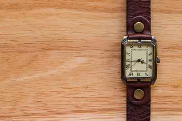 Watch on wood background