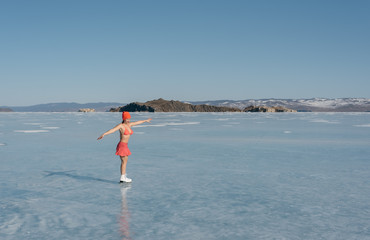 Fototapeta na wymiar Girl extreme sports in a swimsuit on ice skating.
