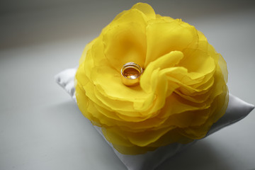 diamond ring on yellow flower. Wedding accessories