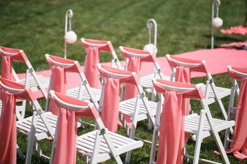Wedding registration beautiful in nature. White chairs for visiting registration. Pink tent with...
