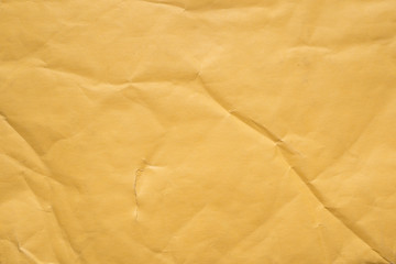crumpled yellow paper