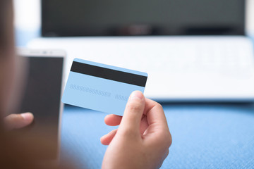 People using credit card paying online.