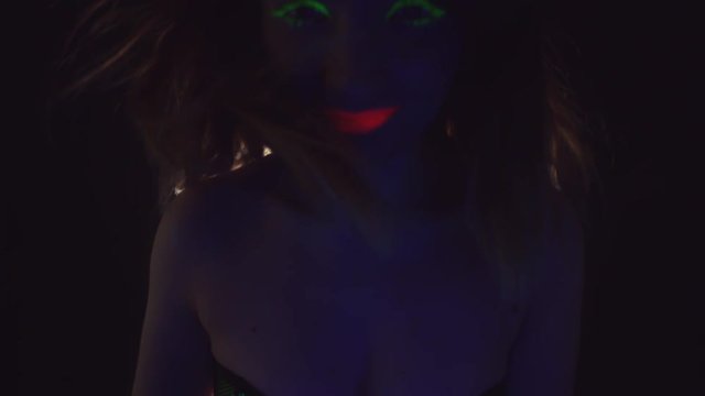 4K Disco Glow Neon Make-up Woman Smiling with Wind