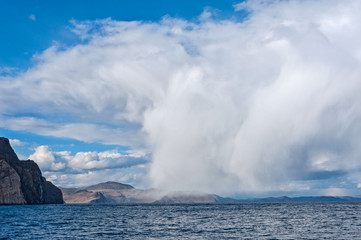 big white cloud over the lake