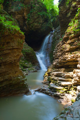 Fototapeta na wymiar Beautifull waterfall is in Western Caucasus, Russia