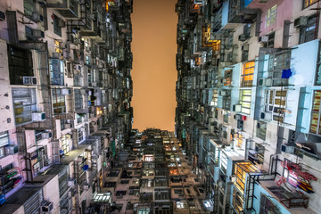 Low angle view of crowded residential towers in an old community in Quarry Bay, Hong Kong. Scenery of overcrowded narrow apartments, a phenomenon of high housing density & housing blues in Hongkong.
